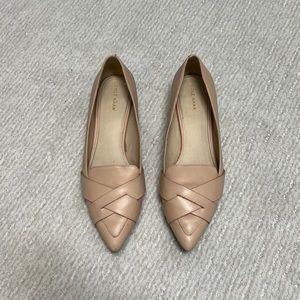 Nude/pale pink Cole Haan flats with 3/4 inch heel.
